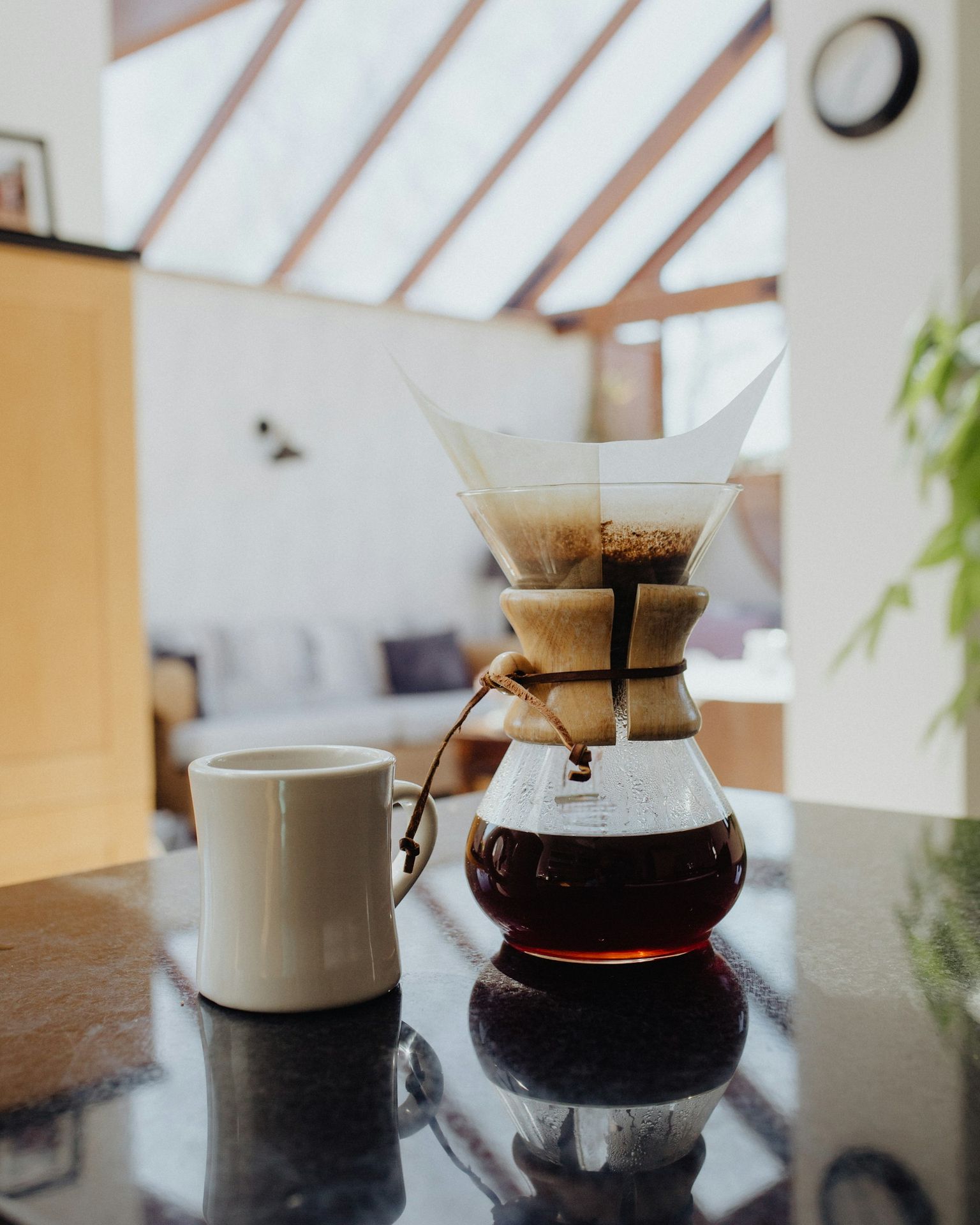 white ceramic mug on brown wooden table